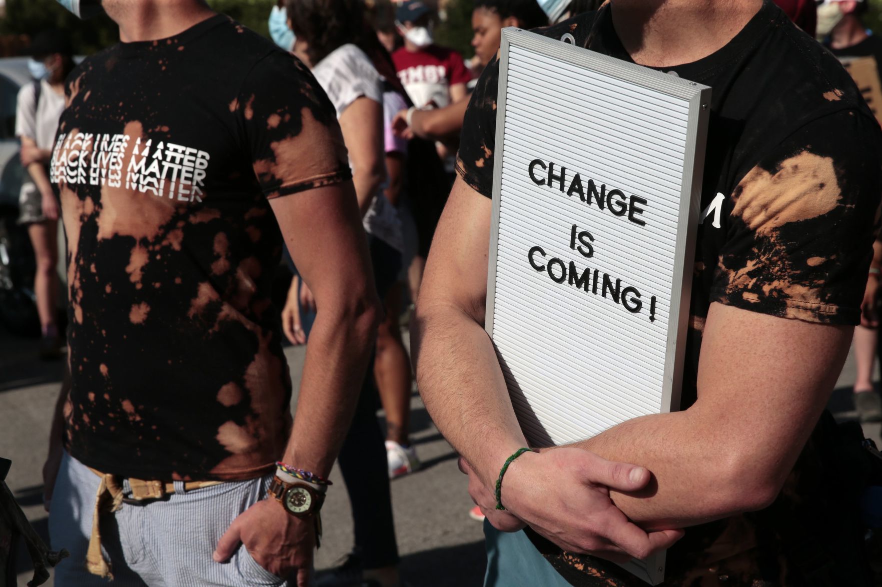 Protesters march through the Delmar Loop